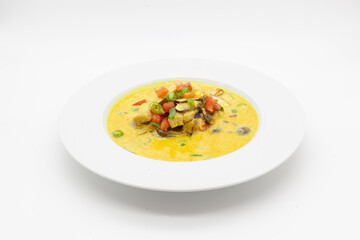 Low carb Curry soup with chicken, coconut milk, champignons, and chilli pepper.