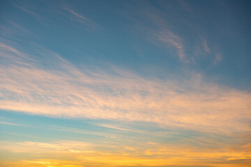 Naklejka na ściany i meble Colorful sky sunrise or sunset with cloud beautiful, Yellow and blue sky background.