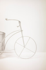Toy decorative bicycle on a white background. Vertical image.