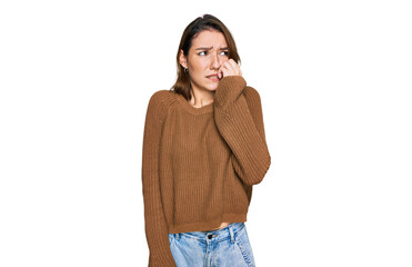 Young caucasian girl wearing casual clothes looking stressed and nervous with hands on mouth biting...