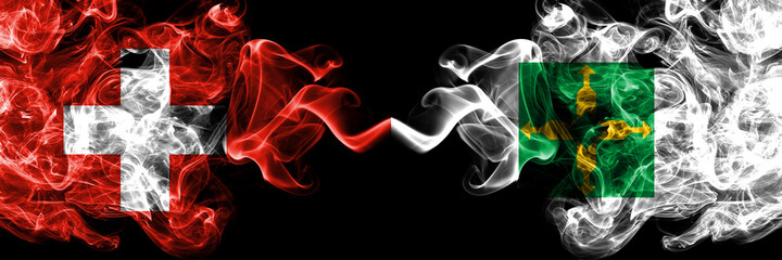 Switzerland, Swiss vs Brazil states, Distrito Federal smoky mystic flags placed side by side. Thick colored silky abstract smoke flags.