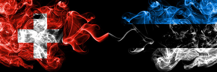 Switzerland, Swiss vs Estonia, Estonian smoky mystic flags placed side by side. Thick colored silky abstract smoke flags.