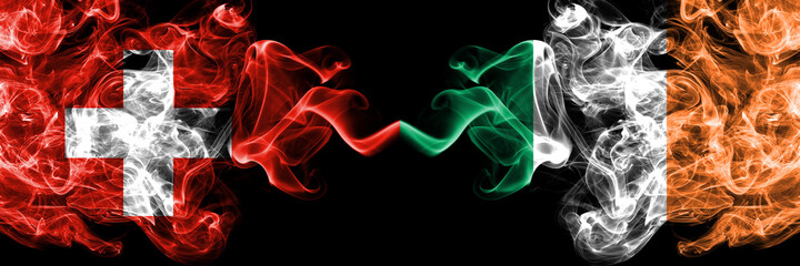 Switzerland, Swiss vs Ireland, Irish smoky mystic flags placed side by side. Thick colored silky abstract smoke flags.