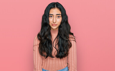 Fototapeta premium Hispanic teenager girl with dental braces wearing casual clothes depressed and worry for distress, crying angry and afraid. sad expression.