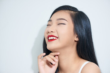 Young Asian woman with smiley face isolated on white background.