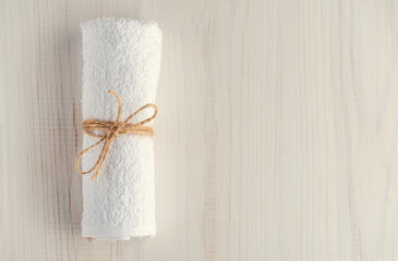 Obraz na płótnie Canvas white towel on a wooden surface