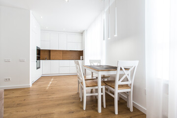 Fototapeta na wymiar Interior photography, large white kitchen studio in a modern style, minimalism