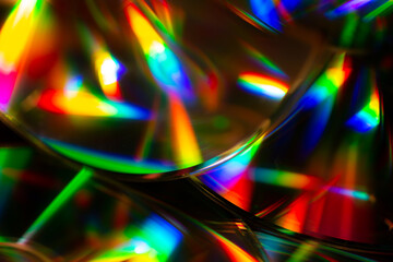 Macro shot of CDs with colorful reflections