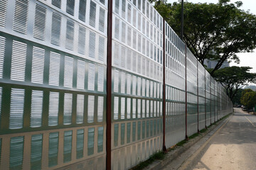 SELANGOR, MALAYSIA - JULY 2, 2020: Noise barriers are installed along the vehicle lane bordering...