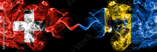 Switzerland, Swiss vs United States of America, America, US, USA, American, Philadelphia, Pennsylvania smoky mystic flags placed side by side. Thick colored silky abstract smoke flags.