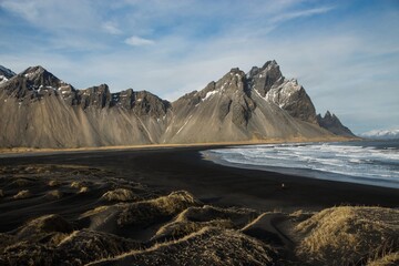 Panoramic view of black sand beach at Stokksnes with Vestrahorn mountain near Hofn South Iceland...