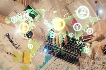 Multi exposure of man's hands typing over computer keyboard and forex graph hologram drawing. Top view. Financial markets concept.