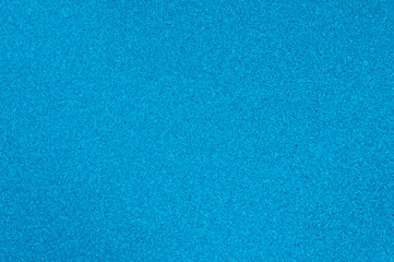The use of polished granite texture of blue color for the background.