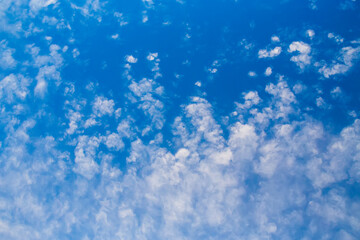 Fototapeta na wymiar Blue clean sky with white clouds background