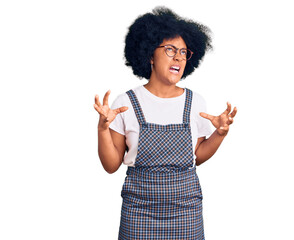 Young african american girl wearing casual clothes crazy and mad shouting and yelling with aggressive expression and arms raised. frustration concept.