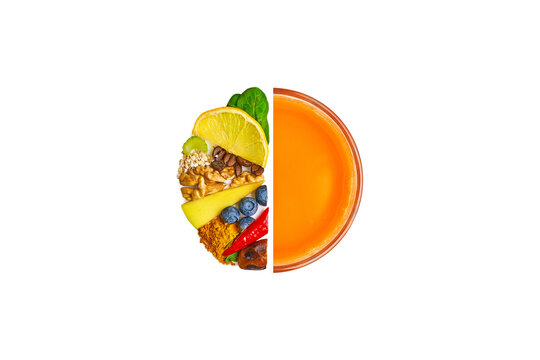 Sirtfood diet concept. Half a glass of  carrot juice and half of glass shape filled with sirtfood diet products. Spinach, lemon, coffee, celery, nuts, apple, turmeric, blueberries, peppers. Top