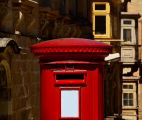 Typical british style traditional red mailbox. Malta