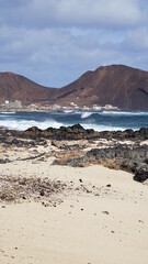 Fototapeta na wymiar the view of a volcano from the beach in Caihau, on the island Sao Vicente, Cabo Verde, in the month of November