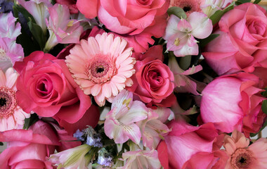 Beautiful colorful background of fresh rose buds and alstroemeria flowers