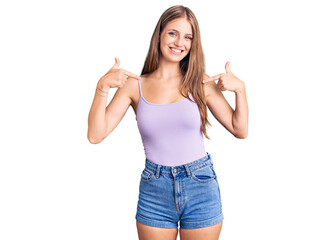 Young beautiful blonde woman wearing casual style with sleeveless shirt looking confident with...