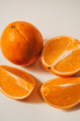 Whole and sliced orange on a background