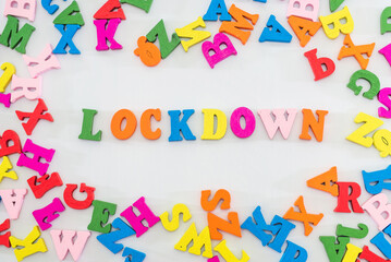 The word "LOCKDOWN" is composed of multi-colored letters.