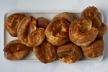 Yorkshire Puddings top view on a white tray