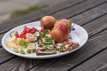 Fruits And Whole-grain Breads On Rustic Wooden Table