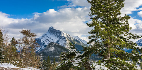 Snow-covered Mount Rundle with snowy forest. Banff National Park beautiful landscape in winter. Canadian Rockies, Alberta, Canada.