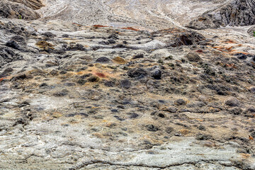 Apocalyptic landscape like a planet Mars surface. Solidified red-brown black Earth surface. Barren, cracked and scorched land. Global warming concept. Refractory clay quarries.