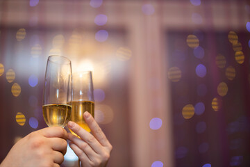 Beautiful view of man and women holding champagne glass. Love. Holiday.