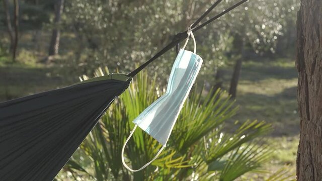Face mask hanging from a tent.
