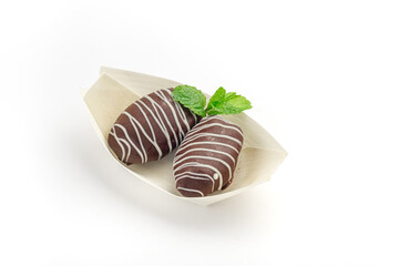 Chocolate covered dates sweet arab candies for dessert isolated on white