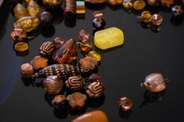 pendants of stones and red ornaments and shades of orange silver and gold and glass handmade glass manufactured cordoba argentina