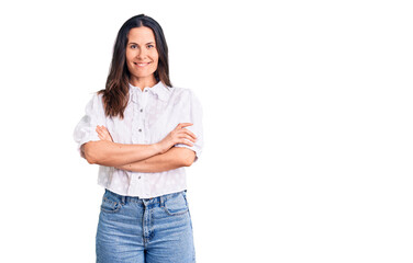 Young beautiful brunette woman wearing casual shirt happy face smiling with crossed arms looking at the camera. positive person.