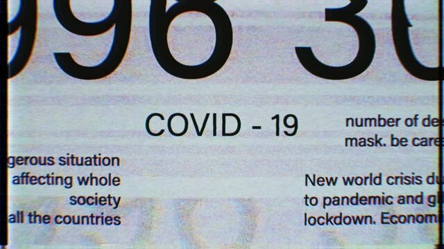 COVID-19 sign in the middle. Dynamic blinking Global outbreak information reports, world news, titles, keywords. Noise, vhs, glitch effects. International media concept. Coronavirus. 4K animation 