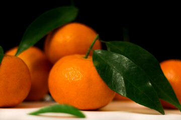 tangerines on a black background