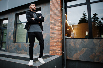 Portrait of stylish arab beard man wear grey turtleneck and black jaket. Arabian model guy.