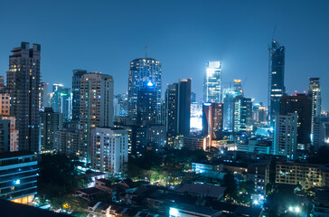 Fototapeta na wymiar View Of Skyscrapers Lit Up At Night