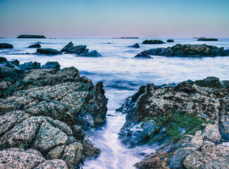 Rocky Coastline With Weathered Rocks During The Blue Hour In The Strait Of Gibraltar, Spain