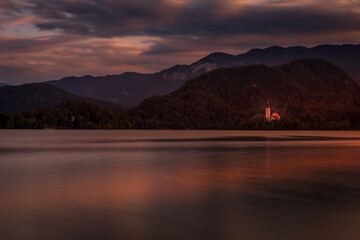 Panoramic evening view of Pilgrimage Church of the Assumption of Maria. Fantastic summer scene of lake Bled, Julian Alps, Slovenia, Europe. Traveling concept background.