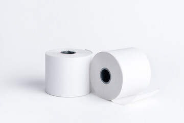 One roll of paper for the cash register stands, and the second lies on a white background