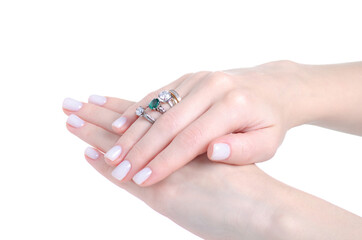 Female hand with many rings on white background isolation