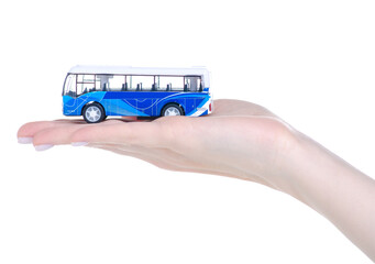 Toy model bus in hand on white background isolation