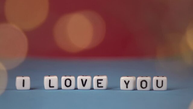 I love you against the background of rose petals . Valentine's Day. Background concept of love and beauty