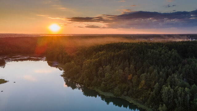 Aerial view of beautiful sunset near lake in Lithuania by drone © Romas