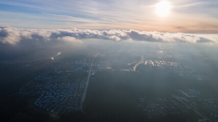 Aerial view of city from above the clouds by drone