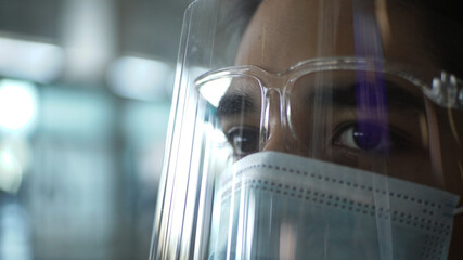 young man with mask and face shield protection from virus and pandemic care equipment 