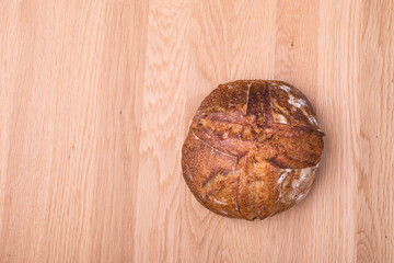 Round loaf of freshly backed sourdough bread