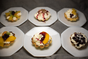 tartlets made of dough with cream and fruit
